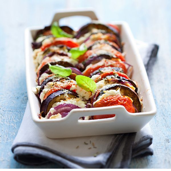 a white dish with food in it